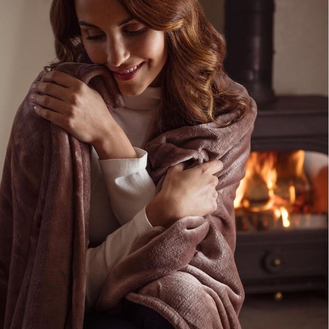 It’s what many of you have been waiting for! The phenomenal success of Heat Holders socks has led to several additional products, such as hats and Gloves (and the new Snugover fleece jumper!) and now thermal blankets with all the warmth and comfort known of the Heat Holders technology. Our new Heat Holders Thermal Blanket is made of a luxuriously soft fur-like fleece we call Heatweaver, that has been developed with the main intention of being efficient at retaining heat, which is why it has an official tog rating of 1.7 TOG – it’s measurably warmer to the touch. The Heat Holders Thermal Blanket is a large 180 x 200 cm so it lets you wrap up and unwind on those cosy lounge-around days! It’s incredibly soft and very easy to look after, as it’s fully machine washable. So, with heating costs rising, don’t get cold – get a Heat Holders Thermal Blanket! With many different uses this blanket can fit in any room of the house. It is also a perfect gift for Christmas or any occasion, as it comes packed in a box to make wrapping up easier! A ribbon is also wrapped around the blanket inside the box for those extra presentation points. Available in 16 bright and classic colours, so you can for-sure find one to match your room or pick whatever you fancy!