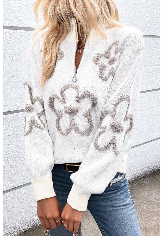 Elegant white sweater with contrasting flower pattern
  Half
  zip design is unique and flexible
  Stand neck provides a stylish and warm look
  Perfect for adding a chic twist to your casual outfits
  Available in a range of sizes
  Made of high
  quality elastic material for a comfortable fit