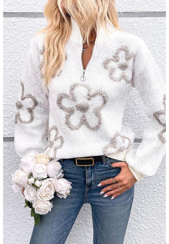 Elegant white sweater with contrasting flower pattern
  Half
  zip design is unique and flexible
  Stand neck provides a stylish and warm look
  Perfect for adding a chic twist to your casual outfits
  Available in a range of sizes
  Made of high
  quality elastic material for a comfortable fit