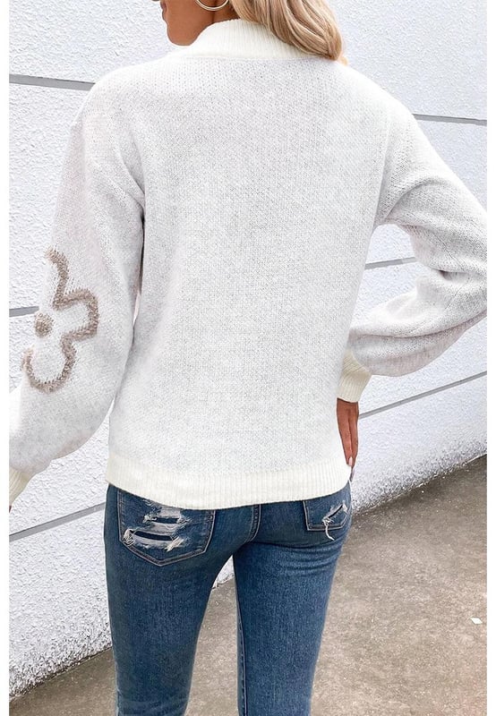 Elegant white sweater with contrasting flower pattern
  Half
  zip design is unique and flexible
  Stand neck provides a stylish and warm look
  Perfect for adding a chic twist to your casual outfits
  Available in a range of sizes
  Made of high
  quality elastic material for a comfortable fit