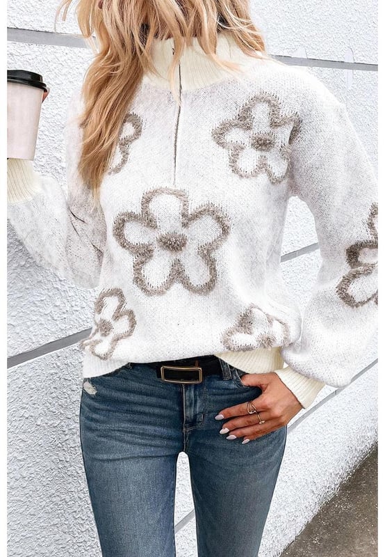 Elegant white sweater with contrasting flower pattern
  Half
  zip design is unique and flexible
  Stand neck provides a stylish and warm look
  Perfect for adding a chic twist to your casual outfits
  Available in a range of sizes
  Made of high
  quality elastic material for a comfortable fit