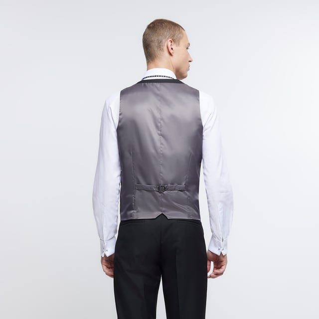 Skinny fit, V-neck, Sleeveless, Front welt pockets, Button fastening, Adjustable back fastening, Part of 3 piece suit, Made with at least 30% recycled polyester