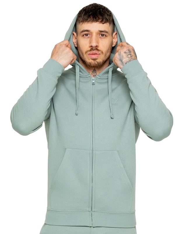 Be ready to conquer any day in the Enzo Mens Zip Hoodie Tracksuit Set. With its comfortable regular fit, long sleeve zip hoodie with cuffed wrists, and adjustable drawstrings, this set will have you looking and feeling your best. The joggers feature the iconic EZ logo and also have a regular fit with cuffed legs and an elasticated waistband with a drawstring for a custom fit. The set is functional with 2 side slash pockets and a single welt back pocket, making it perfect for both casual and work wear.