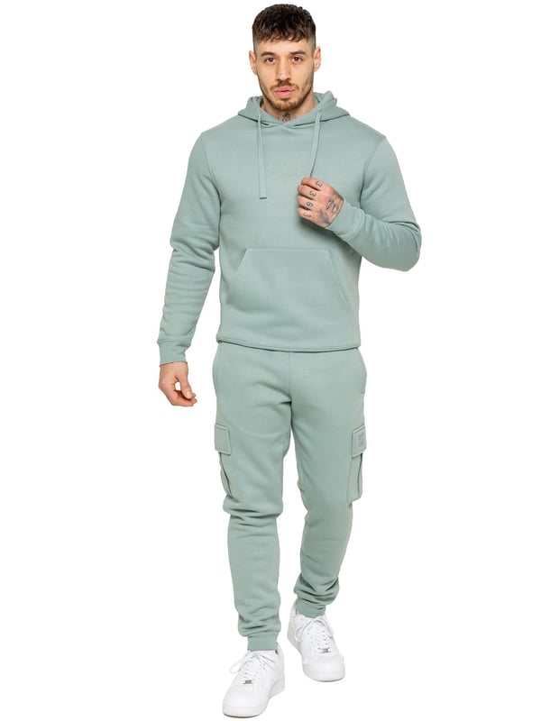 Enzo Mens Overhead Hoodie Tracksuit Set. Regular Fit, Long Sleeve Hoodie with Cuffed Wrists and Adjustable Drawstrings. Features EZ Logo On Chest And Joggers. Regular Fit Cargo Jogger. Elasticated Waistband With Adjustable Drawstring. Features 2 Side Slash Pockets, 2 Cargo Pockets, Single Welt Back Pocket. Ideal to use for Casual and Work wear.