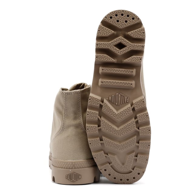 Elevate your streetwear with the athletic version Pampa Hi sneakerboot. Featuring a durable canvas upper in a rugged monochrome colorway, this versatile boot is built for both style and function. Designed for long-lasting comfort, it includes a hard-wearing lugged rubber outsole, a supportive heel cup cradle, and a protective rubber toe cap. Finished with the signature Palladium ankle patch and woven tag for an authentic touch.