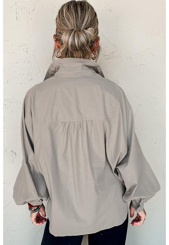 Collared neck for a classic look
  Balloon sleeves add a trendy touch
  Loose fit for comfort and style
  Side slits for added detail
  Pairs well with suit pants skirts and jeans
  Plain color for easy matching
Material: 100% Cotton