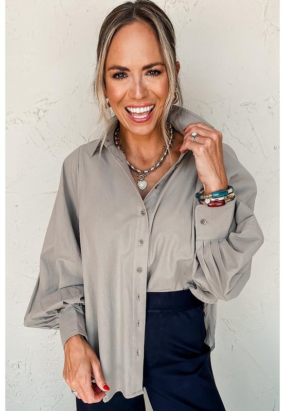 Collared neck for a classic look
  Balloon sleeves add a trendy touch
  Loose fit for comfort and style
  Side slits for added detail
  Pairs well with suit pants skirts and jeans
  Plain color for easy matching
Material: 100% Cotton