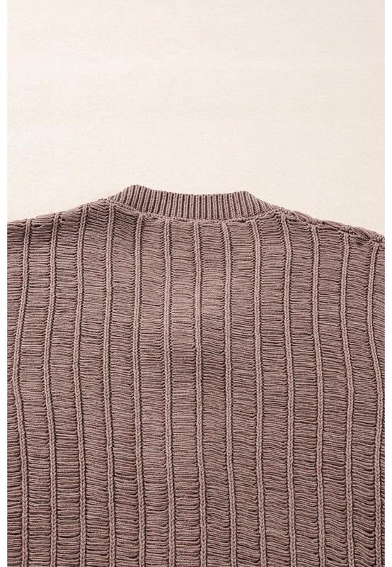 Soft textured knit fabric for comfort and warmth
  Unique cut
  out details for a modern touch
  Buttoned front for easy layering
  Ideal for pairing with a vest and jeans
  Versatile cardigan that complements any outfit
  Available in various sizes with high elasticity
Material: 60% Cotton 40% Acrylic