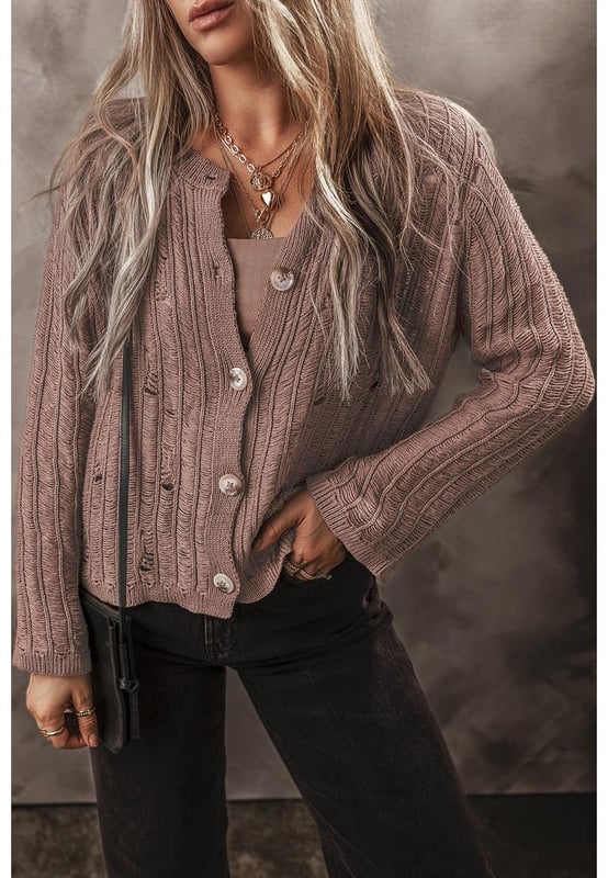 Soft textured knit fabric for comfort and warmth
  Unique cut
  out details for a modern touch
  Buttoned front for easy layering
  Ideal for pairing with a vest and jeans
  Versatile cardigan that complements any outfit
  Available in various sizes with high elasticity
Material: 60% Cotton 40% Acrylic