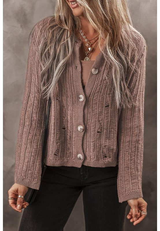 Soft textured knit fabric for comfort and warmth
  Unique cut
  out details for a modern touch
  Buttoned front for easy layering
  Ideal for pairing with a vest and jeans
  Versatile cardigan that complements any outfit
  Available in various sizes with high elasticity
Material: 60% Cotton 40% Acrylic