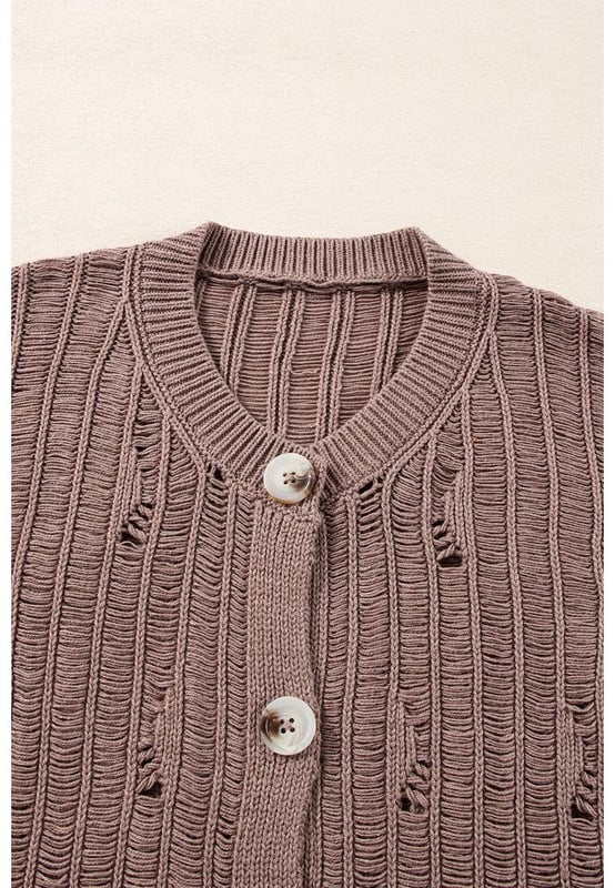 Soft textured knit fabric for comfort and warmth
  Unique cut
  out details for a modern touch
  Buttoned front for easy layering
  Ideal for pairing with a vest and jeans
  Versatile cardigan that complements any outfit
  Available in various sizes with high elasticity
Material: 60% Cotton 40% Acrylic