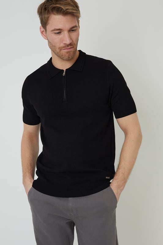 Your casual classics get a makeover with this zip-neck knitted polo shirt from Threadbare. In an all-over jersey stitch, the cuffs and hem are finished with a subtle rib with textured trim detail. This knitted polo has a stylish concealed quarter zip and ribbed collar with textured trim for an elevated touch and is finished with a branded metal tab above the hem. Pair it with chinos or jeans for day-to-day wear that also works perfectly for date night, or team with shorts for summer style.