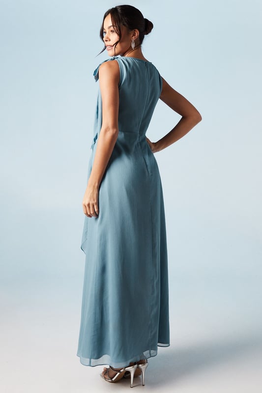 Elegant one-shoulder design with tie detail
        Flowing chiffon fabric for graceful movement
        Flattering waterfall drape enhancing the silhouette
        Floor-length maxi style for a sophisticated look
        Versatile design suitable for various bridesmaid styles
    
    This exquisite bridesmaid dress from Coast embodies timeless elegance and feminine charm. The one-shoulder neckline with delicate tie detail adds a touch of romance, while the flowing chiffon fabric ensures graceful movement as you glide down the aisle. The waterfall drape cascades beautifully, creating a flattering silhouette that complements various body types. Perfect for weddings in any season, this maxi dress can be styled to suit different themes and colour palettes. Pair with strappy heels and delicate jewellery for a polished look that will complement the bride's ensemble. The versatile design allows for easy coordination with other bridesmaids, ensuring a cohesive and stunning bridal party. This Coast dress is a beautiful choice for those seeking a blend of sophistication and modern style for their special role in the wedding celebration.