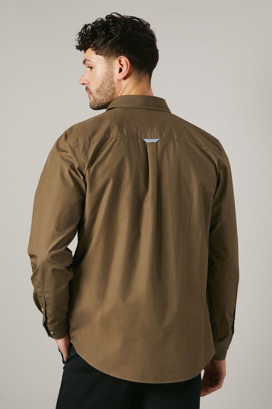 Versatile long sleeve shirt in poplin fabric
        Double chest pockets with button closures
        Classic collar and full-length button placket
        Adjustable cuffs for a customised fit
        Subtle brand detailing on the back yoke
    
    This Maine khaki poplin shirt is a wardrobe essential that seamlessly blends functionality with style. The double chest pockets add a utilitarian touch, perfect for those who appreciate practicality in their attire. Its versatile design makes it suitable for a range of casual occasions, from laid-back weekend brunches to family gatherings. Style it as seen on our model - pair it with dark trousers and white trainers for a smart-casual look that's effortlessly cool. For a more relaxed vibe, leave it unbuttoned over a plain white tee and combine with your favourite jeans. The adjustable cuffs allow you to roll up the sleeves for a more casual appearance or keep them buttoned for a neater finish. This shirt is a true chameleon in your wardrobe, easily dressed up or down to suit your needs, making it an indispensable piece for the modern British man.