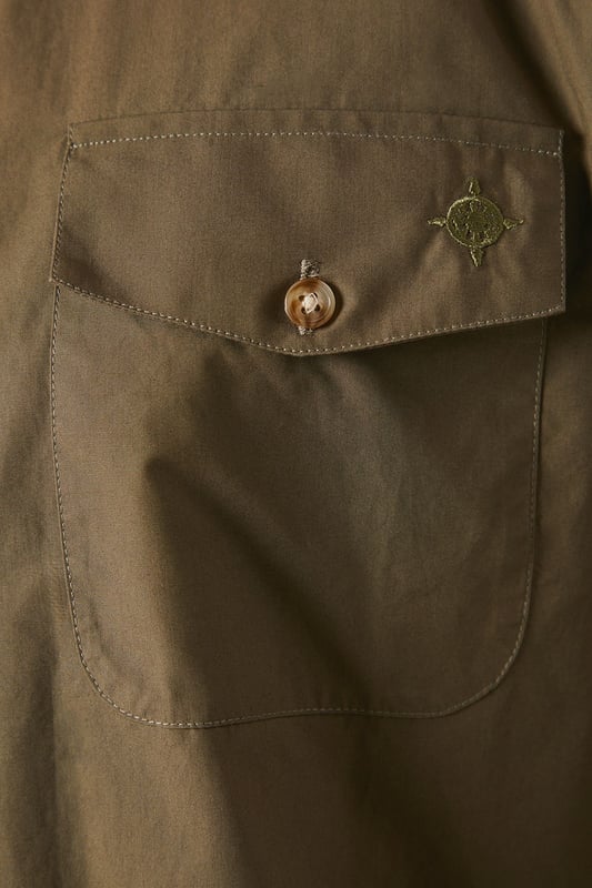 Versatile long sleeve shirt in poplin fabric
        Double chest pockets with button closures
        Classic collar and full-length button placket
        Adjustable cuffs for a customised fit
        Subtle brand detailing on the back yoke
    
    This Maine khaki poplin shirt is a wardrobe essential that seamlessly blends functionality with style. The double chest pockets add a utilitarian touch, perfect for those who appreciate practicality in their attire. Its versatile design makes it suitable for a range of casual occasions, from laid-back weekend brunches to family gatherings. Style it as seen on our model - pair it with dark trousers and white trainers for a smart-casual look that's effortlessly cool. For a more relaxed vibe, leave it unbuttoned over a plain white tee and combine with your favourite jeans. The adjustable cuffs allow you to roll up the sleeves for a more casual appearance or keep them buttoned for a neater finish. This shirt is a true chameleon in your wardrobe, easily dressed up or down to suit your needs, making it an indispensable piece for the modern British man.
