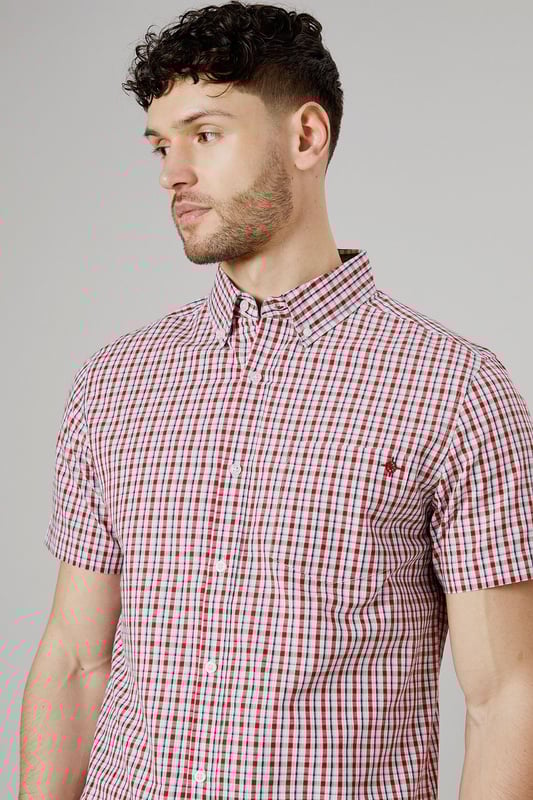 Classic button-down collar for a timeless look
        Short sleeves perfect for warmer weather
        Versatile check pattern adds visual interest
        Single chest pocket for a functional touch
        Back pleat for enhanced comfort and movement
    
    This Maine casual check shirt is a wardrobe essential that combines style and comfort effortlessly. The woven fabric ensures a crisp appearance while allowing breathability, making it ideal for various casual occasions. Style it with light grey chino shorts and white trainers for a relaxed weekend look perfect for family gatherings or casual outings. For a smart-casual ensemble, pair it with dark denim jeans and desert boots. The versatile check pattern allows for easy coordination with solid-coloured bottoms, making it a go-to choice for your everyday wardrobe. Whether you're heading to a backyard barbecue or meeting friends for a casual lunch, this shirt will keep you looking sharp and feeling comfortable throughout the day.