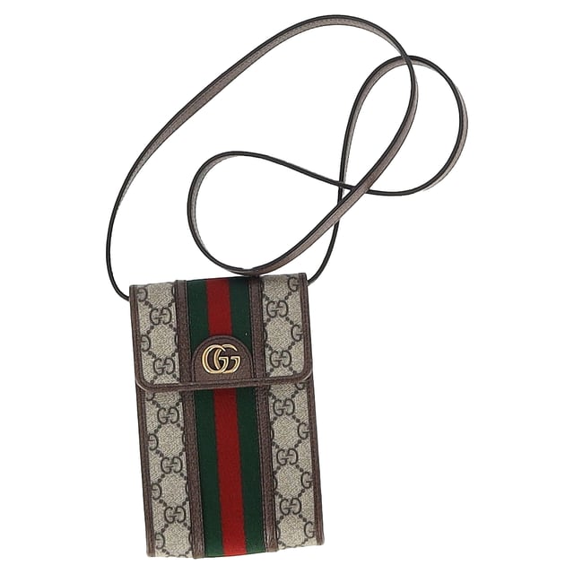 VINTAGE, RRP AS NEW
Elevate your on-the-go style with the Gucci Ophidia Flap Phone Holder Bag in elegant beige coated canvas. Featuring the brand's iconic GG Supreme pattern and the signature green and red Web stripe, this compact yet functional phone holder offers a luxurious way to carry your essentials. Designed with modern convenience in mind, it features a flap closure for easy access to your phone and other small items.

 Gucci Ophidia Flap Phone Holder Bag in Beige Coated Canvas

Condition: Excellent
Signs of wear: No retail tag, No visible sign of wear., 
Packaging: Dust bag
Color: Beige
Material: Canvas | coated/waterproof canvas
Size: One Size | One Size
Measurements: Width: 20; Height: 180; Length: 115; Handle drop: 500; Strap length: 1000
SKU: MRPPUGBBA459666M
