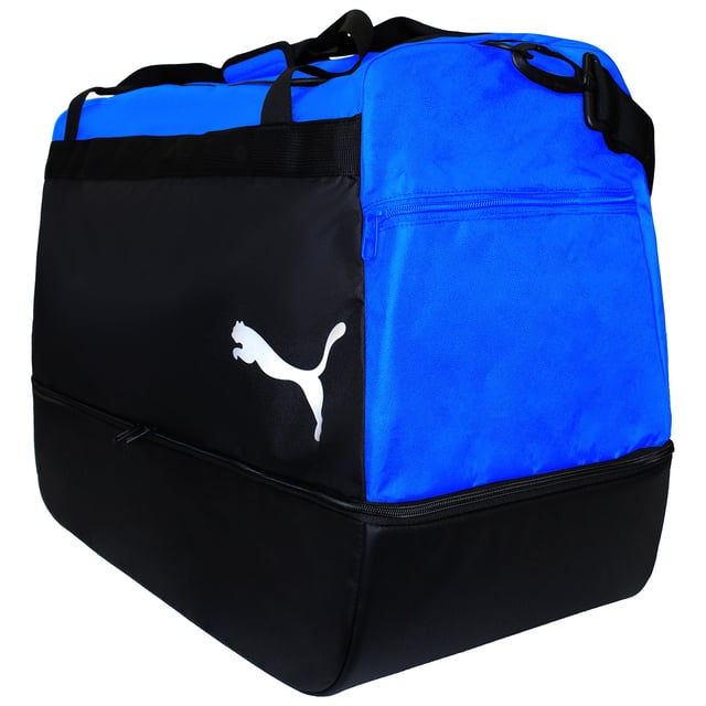 The Puma TeamGoal 23 Black/Blue Hardcase Bag is an excellent choice for athletes who need a reliable and protective bag for their gear. Whether you're heading to a match, training session, or even traveling, this bag is built to keep your equipment safe while offering ample storage space. The hardcase design offers superior protection from bumps and impacts, so you can rest assured that your gear will stay in top condition.
Key Features:
Hardcase Protection: 

The hard shell exterior ensures that your equipment is protected from any rough handling or impacts, which is ideal for transporting delicate or important gear.


Spacious Storage: 

With a generous main compartment, this bag has plenty of space for all your essentials, including clothes, boots, balls, and accessories. There are also additional side pockets to keep smaller items organized.


Durable and Stylish: 

Made from durable materials, this bag is built to withstand wear and tear. The sleek black and blue color combination gives it a modern, sporty look, perfect for any athlete who wants to showcase their style.


Comfortable Carrying: 

The bag is equipped with adjustable shoulder straps and a carry handle, making it easy to carry whether you're rushing to the field or traveling to a tournament.