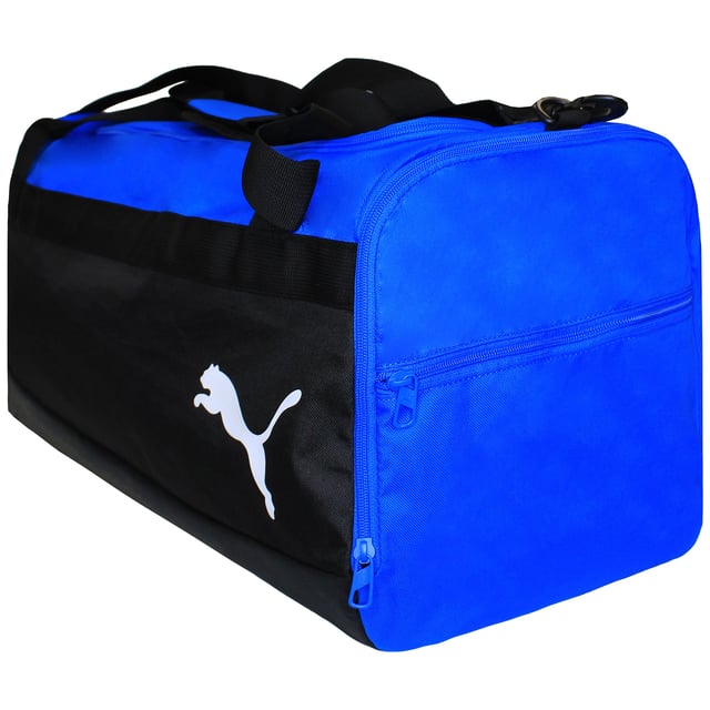 "The Puma 54L TeamGoal 23 Black/Blue Football Bag is designed for athletes who need a spacious and durable bag to carry all their gear. Whether you're heading to the pitch for a game, training, or practice, this football bag offers plenty of room and functionality to keep your essentials organized and easily accessible. With its sleek black and blue color scheme and high-performance features, it's the ideal companion for your sporting activities.
Key Features:
Large Capacity (54L): 

With a generous 54-liter capacity, this bag offers plenty of space to store your football gear, clothing, shoes, water bottle, and more. It's large enough to hold all your essentials without being overly bulky.


Durable &amp; High-Quality Material: 

Made with durable, water-resistant materials, this bag is built to withstand the rigors of sports activities, ensuring it lasts through multiple seasons of use.


Multiple Pockets: 

Equipped with multiple compartments, including a large main compartment, side zip pockets, and a front pocket, the bag offers easy organization of your gear, allowing you to separate your clean clothes from your dirty ones or keep smaller items secure.


Adjustable Shoulder Straps: 

The adjustable shoulder straps with padding allow for a comfortable, customizable fit, ensuring you can carry the bag with ease and comfort, even when it's full.