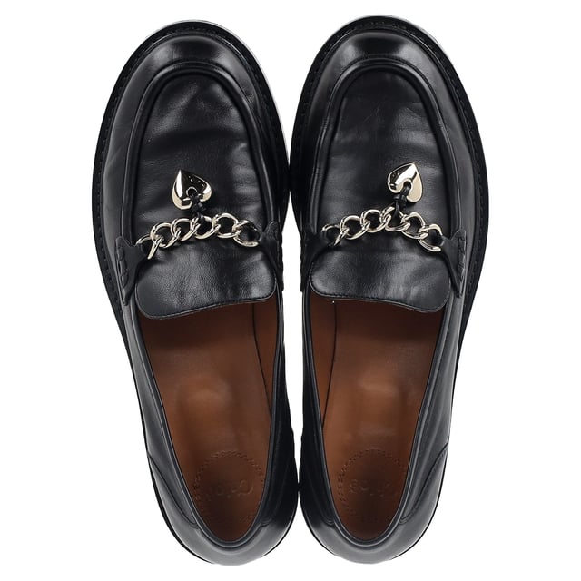 VINTAGE, RRP AS NEW
The Chloé Ninna Heart Chain Detail Loafers in Black Leather offer a perfect blend of sophistication and playful charm. Crafted from luxurious black leather, these loafers feature a unique heart-shaped chain detail that adds a touch of femininity and edge. Pair them with tailored trousers for a sleek, polished office look or dress them down with a midi skirt and a simple blouse for a more relaxed yet stylish vibe. Add gold accessories to complement the chain detail and complete your chic ensemble effortlessly.

 Chloé Ninna Heart Chain Detail Loafers in Black Leather

Condition: Very good
Signs of wear: Minor markings, Lightly used but very well maintained. Minor mark at soles & creasing, light scuffing at the soles and heels.
Packaging: Dust bag
Color: Black
Material: Leather | leather
Size: EU | 40
Measurements: Insole length: 290
SKU: NAPPUGBSH461139W