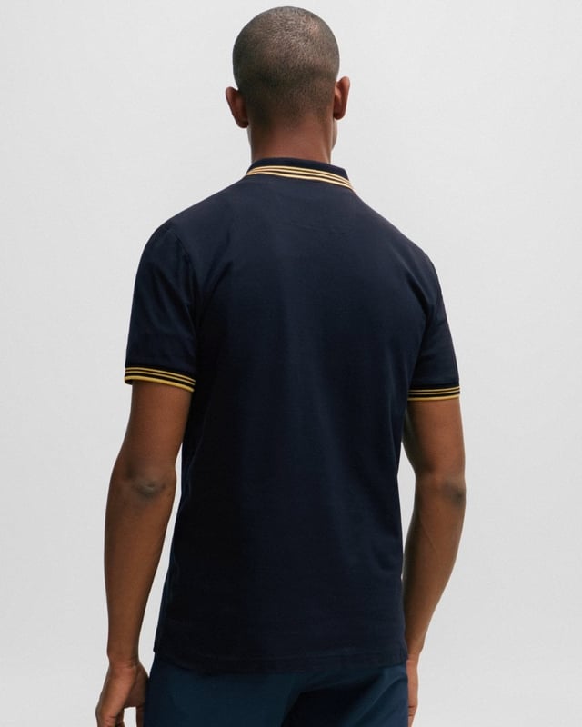 A contemporary polo shirt cut to a defined fit by BOSS Menswear, created in stretch cotton with contrast stripes and branding.

Slim fit
Flat-knit collar
Number of buttons: 2
Short sleeves
Flat-knit cuffs
Standard length
92% Cotton, 8% Elastane

50506193
