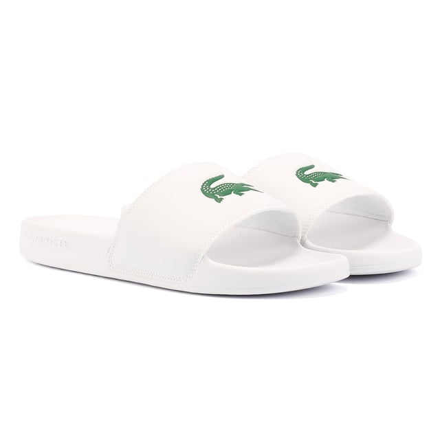 Slides featuring a smooth, rubberized upper for a sleek finish. Wide strap with bold logo detailing. Lightweight and durable design for all-day comfort.