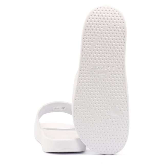 Slides featuring a smooth, rubberized upper for a sleek finish. Wide strap with bold logo detailing. Lightweight and durable design for all-day comfort.