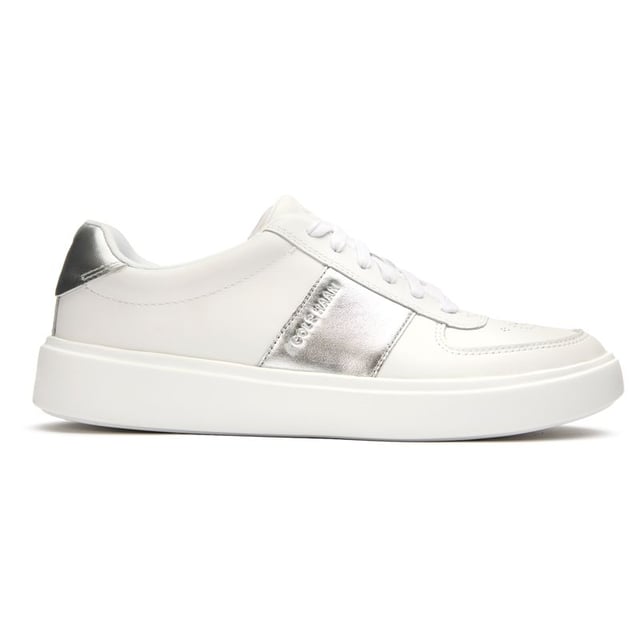 Zapatillas blancas Cole Haan della para mujer, fabricadas en piel y suela de piel. Presentan: suela de copa, parte superior de piel suave, plantilla acolchada y ligereza.
