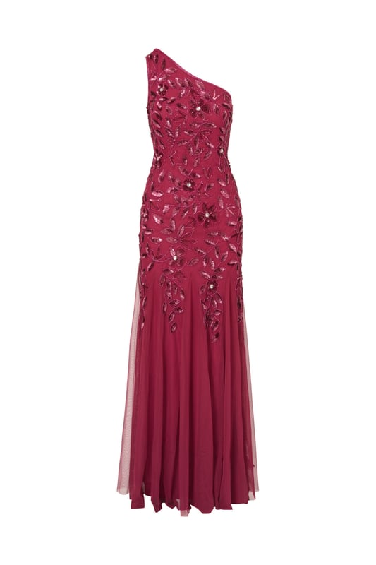 Brighten every ball room you step into in this one shoulder mermaid gown. This formal dress features a fitted bodice, one shoulder neckline, and a mermaid skirt with godet pleats. Crafted from knit mesh that is adorned with stunning sequin beaded florals and the edges are trimmed with lines of tight beading that fades mid-skirt. A hidden zipper closure at the centre back completes this black-tie dress.