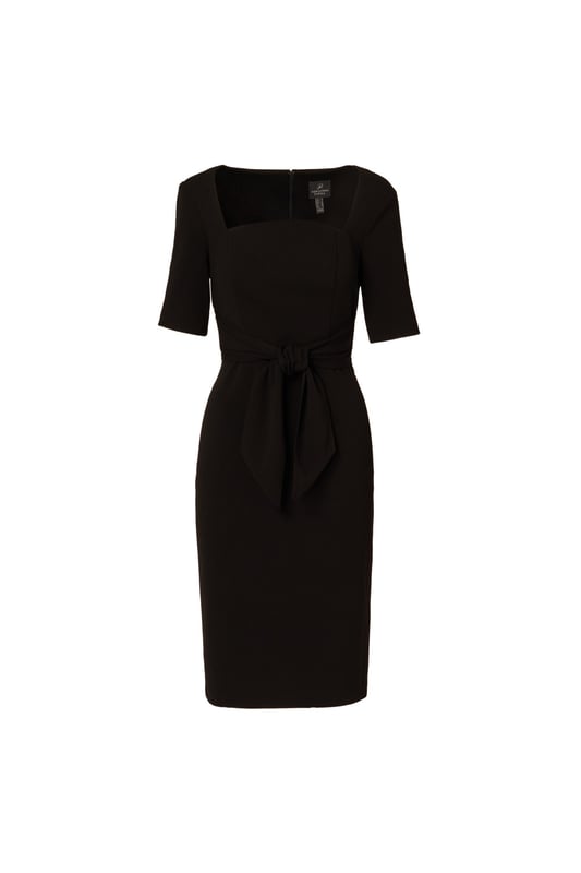 Wherever you go, go boldly in this three-quarter sleeve dress. Crafted from luxurious knit crepe fabric, this dress drapes beautifully while offering comfort and style. The ruffle mock neck adds a touch of femininity, complemented by practical pockets for added functionality. Complete with a self-tie bow at the neck for a hint of femininity, this dress effortlessly transitions from day to evening, making it a versatile addition to any wardrobe. Perfect for both casual outings and special occasions, you will love dressing this trapeze dress up or down.