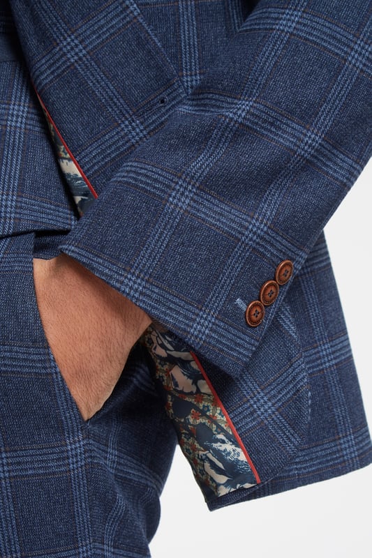 Effortlessly sharp, this navy tweed checked suit jacket features notch lapels, a two button fastening and a trademark slim fit, matched up with a statement lining.A classic suit by Antique Rogue, inspired by a rock and roll attitude and a more rebellious feel for menswear.