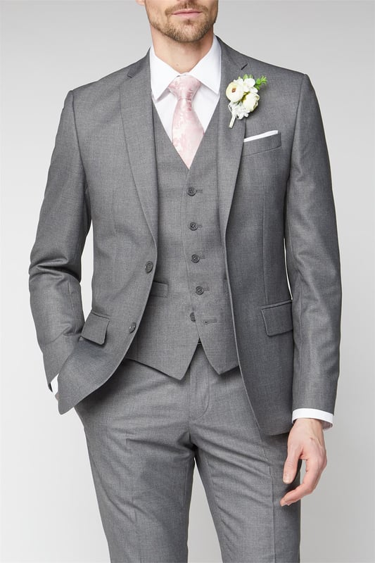 Occasions by Scott & Taylor offer a three piece suit in a variety of fits. From tailored, slim, skinny and regular fit, this range is designed to cater the whole wedding party. This regular fit suit features a jacket with a two button fastening, notch lapels and a contemporary printed lining. Wear with the matching regular fit trousers and adjustable fit waistcoat.