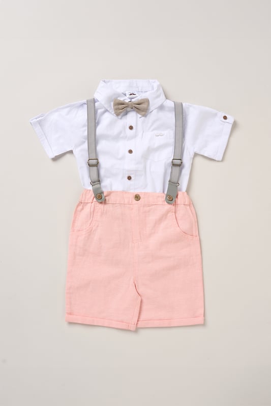 Shirt, Shorts and Braces Outfit Set Dress your little one to impress with this delightful set from Little Gent. Featuring a shirt, bowtie, and shorts with attached braces. Perfect for special occasions or stylish outings, your little one will look effortlessly dapper and be ready to steal the spotlight!