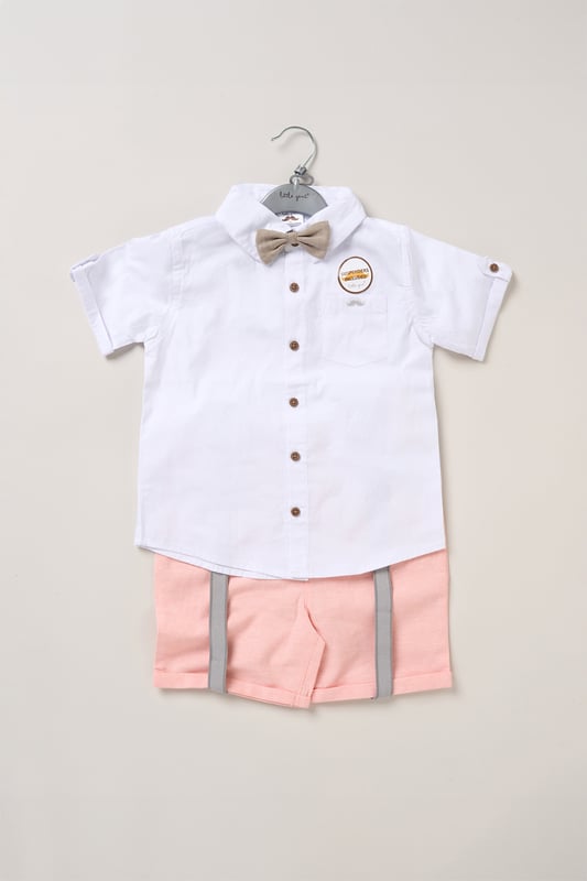 Shirt, Shorts and Braces Outfit Set Dress your little one to impress with this delightful set from Little Gent. Featuring a shirt, bowtie, and shorts with attached braces. Perfect for special occasions or stylish outings, your little one will look effortlessly dapper and be ready to steal the spotlight!