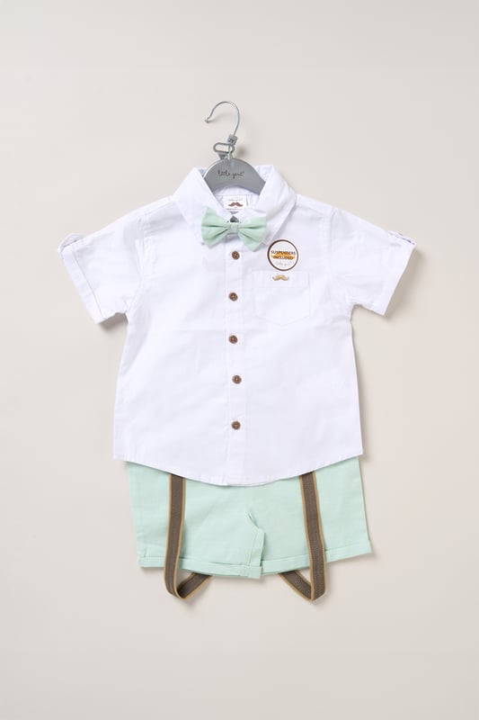 Shirt, Shorts and Braces Outfit Set Dress your little one to impress with this delightful set from Little Gent. Featuring a shirt, bowtie, and shorts with attached braces. Perfect for special occasions or stylish outings, your little one will look effortlessly dapper and be ready to steal the spotlight!