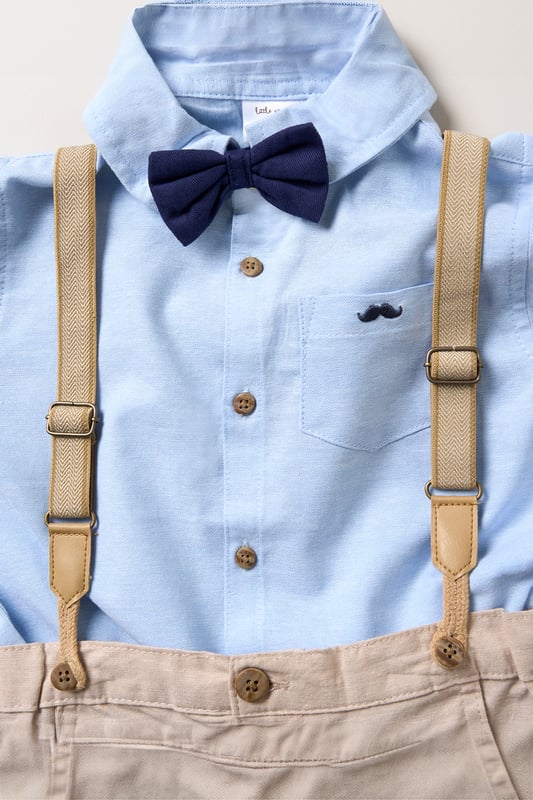 Dress your little one to impress with this delightful set from Little Gent. Featuring a shirt, bowtie, and shorts with attached braces. Perfect for special occasions or stylish outings, your little one will look effortlessly dapper and be ready to steal the spotlight!
