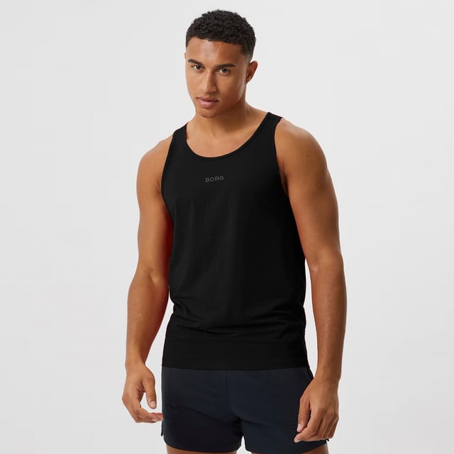 Borg Running Perforated Tank - Breathable and Lightweight Performance: Elevate your running gear with the Björn Borg Borg Running Perforated Tank, designed for athletes who value breathability and comfort. Made from lightweight, recycled polyester, this tank top features perforated fabric for enhanced ventilation, keeping you cool during intense workouts. It offers a regular fit and is perfect for warmer weather or layering. Extra Product Details:. 100% Recycled Polyester Regular Fit Perforated Fabric for breathability Round Neckline Machine Washable. This tank is a must-have for runners looking for a combination of style and performance in their gear.