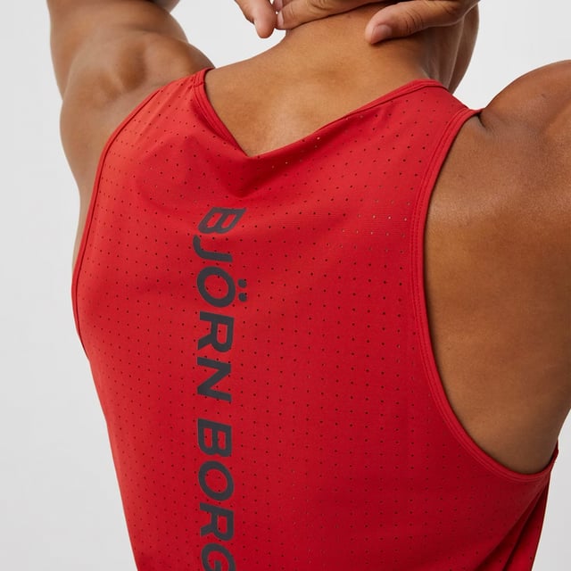 Borg Running Perforated Tank - Breathable and Lightweight Performance: Elevate your running gear with the Björn Borg Borg Running Perforated Tank, designed for athletes who value breathability and comfort. Made from lightweight, recycled polyester, this tank top features perforated fabric for enhanced ventilation, keeping you cool during intense workouts. It offers a regular fit and is perfect for warmer weather or layering. Extra Product Details:. 100% Recycled Polyester Regular Fit Perforated Fabric for breathability Round Neckline Machine Washable. This tank is a must-have for runners looking for a combination of style and performance in their gear.