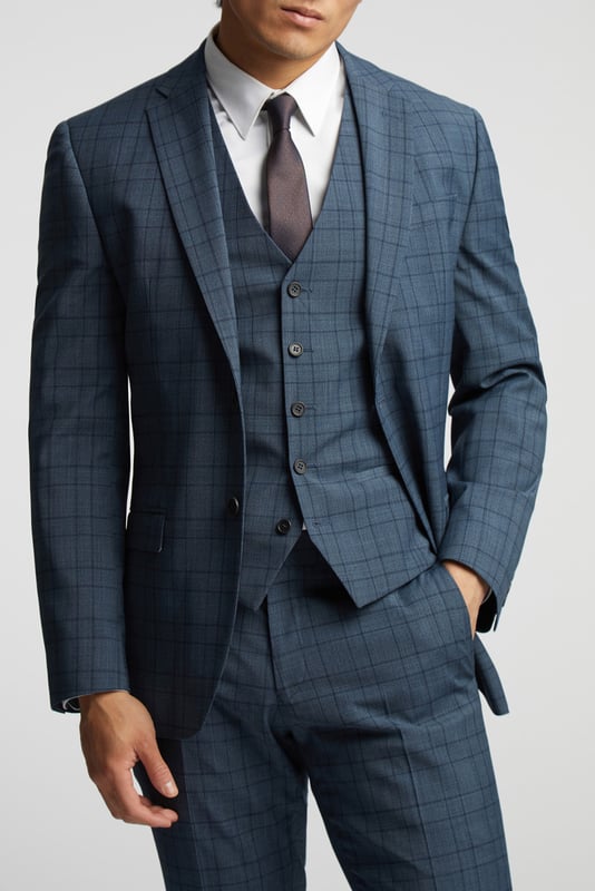 A classic recapture of British tailoring - Alexandre of England present the Blue Soft Check tailored fit suit jacket. Made in a luxurious wool blend with added stretch, for guaranteed comfort and style for any occasion.With a single-breasted, two button fastening, this jacket also features notch lapels, 2 straight flap pockets and tonal printed lining for added impact.