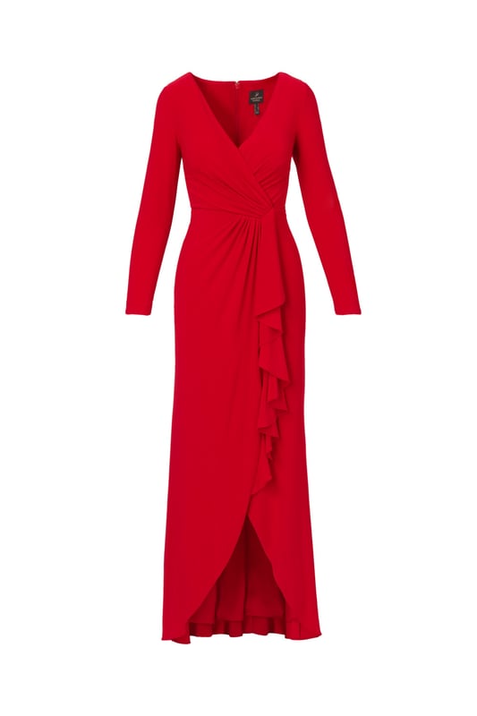 Slinky jersey fabric gives this long sleeve gown dramatic drape and exceptional comfort. A faux wrap construction gives the long dress design dynamic lines across the bodice and down the front of the flowing skirt. The back closes with a zipper and finishes with flattering ruching at the centre hip.