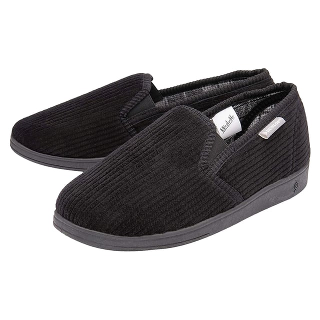Dunlop - Men’s Tartan Lined Slippers With Memory Foam: Introducing Dunlop Men’s Tartan Lined Slippers. A perfect blend of style, comfort, and durability. These men's slippers feature a classic tartan print lining, providing a touch of sophistication to your loungewear. The memory foam padding ensures an exceptionally comfortable experience, creating a soft and supportive buffer between your feet and the floor. The cushioned insole provides an extra layer of comfort, making these slippers supremely soft for your relaxation. Designed with a hard-wearing traction rubber sole, these slippers offer increased comfort and protection. The Dunlop brand has an enviable reputation which extends to its slipper and casual footwear range. Offering the consumer a creative and inspired range of footwear with emphasis being placed on creative trims, innovative fabrics and outstanding comfort. Made from 100% Textile Upper with a rubber sole, there are 5 colours: Black, Navy, Brown, Burgundy & Charcoal. The slippers are available in sizes 7-12 UK. They are hand wash or a low temperature machine wash. Extra Product Details: Dunlop Men’s Slippers Tartan Print Lining Memory Foam Padding Hard Traction Rubber Sole Soft & Comfortable Dunlop Branded Available From Sizes 7-11 UK 5 Colour Options Machine Washable