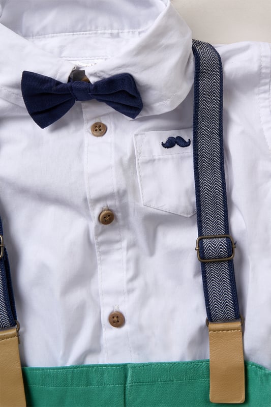 Bodysuit Shirt, Shorts and Braces Outfit Set Dress your little one to impress with this delightful set from Little Gent. Featuring a shirt bodysuit, bowtie, and shorts with attached braces. Perfect for special occasions or stylish outings, your little one will look effortlessly dapper and be ready to steal the spotlight!