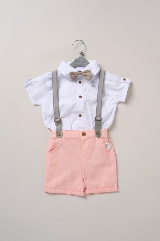 Dress your little one to impress with this delightful set from Little Gent. Featuring a shirt bodysuit, bowtie, and shorts with attached braces. Perfect for special occasions or stylish outings, your little one will look effortlessly dapper and be ready to steal the spotlight!