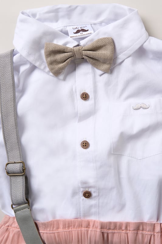 Dress your little one to impress with this delightful set from Little Gent. Featuring a shirt bodysuit, bowtie, and shorts with attached braces. Perfect for special occasions or stylish outings, your little one will look effortlessly dapper and be ready to steal the spotlight!