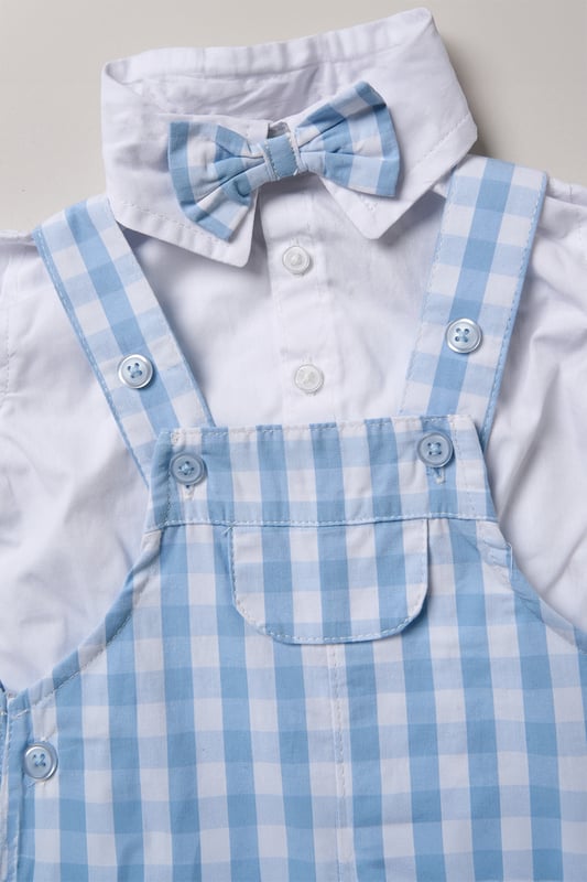 Dress your little one in style with this adorable bodysuit shirt and dungarees set by Little Gent. Complete with a charming bowtie, this outfit is perfect for any occasion. Designed with playful charm and practicality in mind, it’s an ideal choice to keep your little one looking dapper all day long.