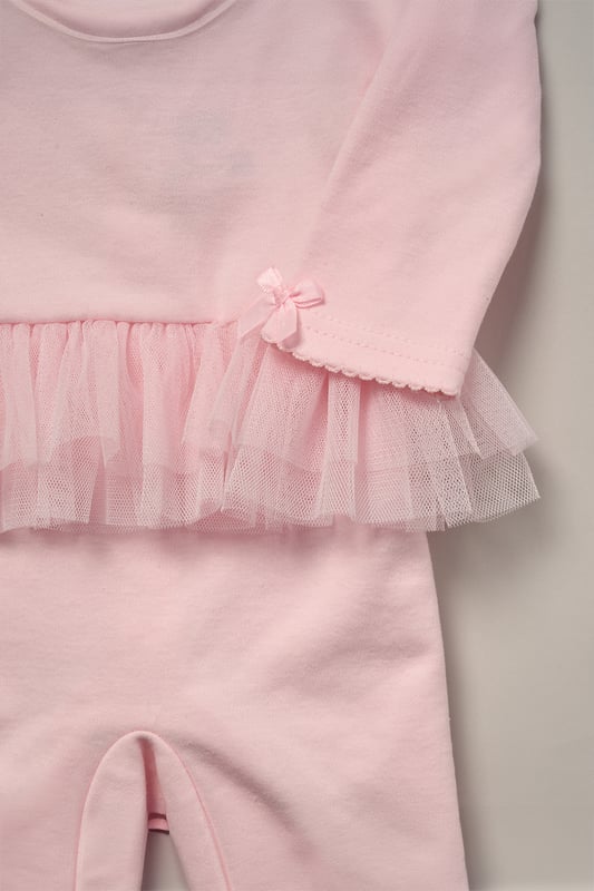 Rose Ribbon Detail All-In-One and Headband Outfit Set This Charming Ribbon Detail All-In-One Set from Rock A Bye Baby Boutique features a button-up all-in-one adorned with a lovely rose ribbon, complete with matching headband also adorned with a rose ribbon. Adding to its adorable charm, the set features a tutu skirt on the back, enhancing its sweet appeal. Each set also comes with a hanger, ensuring easy storage and display. Dress your little one in style and comfort with this set from Rock A Bye Baby Boutique.