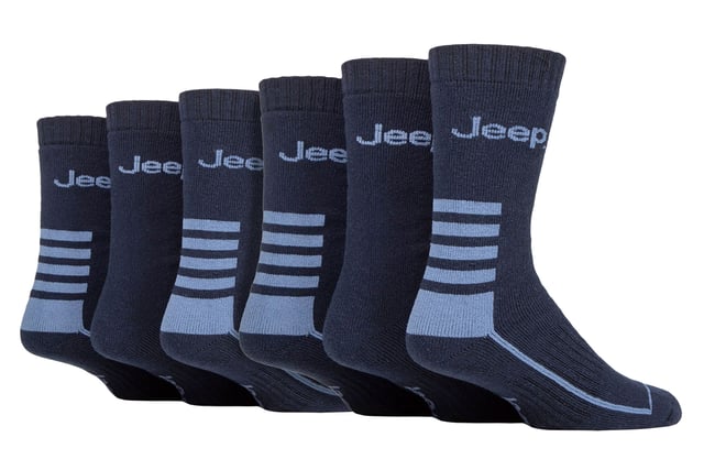 Jeep Mens 6 Pack Cotton Blend Boot Socks: Introducing the Jeep Cotton Blend Boot Socks, a must-have for ultimate comfort and protection! This 6 Pair Pack is crafted from 61% Polyester, 38% Cotton, and 1% Elastane for a perfect blend of softness and durability. The socks feature smooth toe seams and heavy ribbed cuffs for an irritation-free experience. Designed to keep your feet cosy and well-supported, these medium-thickness socks come fully cushioned from cuff to toe. The terry looped pile lining offers excellent defence against cold weather, shocks, impacts, and even tight boot laces or blisters from new leather boots. Whether you're at work or enjoying leisure time, these half calf length socks ensure a more enjoyable day. Plus, the woven Jeep branding on the legs adds a touch of style. Thanks to the breathable cotton blend, your feet stay dry and fresh throughout the day due to natural moisture absorbency. Walk with confidence as the arch supports keep the socks securely in place. And when it's time to wash, simply toss them in the machine at 40° for easy care. Upgrade your sock game with the comfort and reliability of Jeep Cotton Blend Boot Socks. Extra Product Details: Comforting and thickly cushioned for maximum protection against cold, shocks, and impacts. Soft and breathable cotton blend keeps feet dry and fresh. Smooth toe seams for irritation-free wear. Arch supports ensure a secure fit while walking. Heavy ribbed cuffs for added durability. Perfect for work or leisure, providing all-day comfort. Triple pack with woven Jeep branding adds style and value. Easy machine wash at 40° for convenient maintenance.