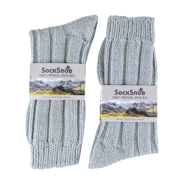 Ladies 100% Wool Bed Socks: Socks that are made from 100% wool and that are fully functional can be hard to find. These ladies 100% wool bed socks are as warm and cuddly as they look. Wool is traditionally known to be one of the best insulating fibres around, trapping warm air and holding it close to your skin. With a 100% wool material composition, these socks have the ultimate ability to keep your feet warm. The top of the sock also has a loose fit - facilitating blood circulation, great if you are relaxing around the house or in bed for a less constrictive feel. These ladies socks also have a ribbed Nordic-like pattern that rides up the sock from the toe to the welt. This pair of ladies 100% wool bed socks are available in the colour natural and are a size 4-7 UK 37-42 eur. They come in a 1 pair pack and are machine washable. Extra Product Details: - 1 Pair Pack - Size 4-7 UK 37-42 - Ladies socks - 100% Wool - Perfect for relaxing - Non-constricting top - Nordic-like knitting pattern - Machine Washable