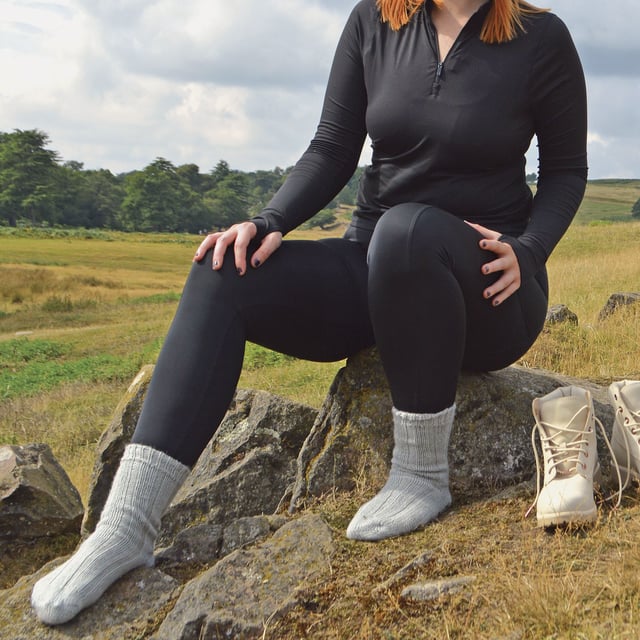 Ladies 100% Wool Bed Socks: Socks that are made from 100% wool and that are fully functional can be hard to find. These ladies 100% wool bed socks are as warm and cuddly as they look. Wool is traditionally known to be one of the best insulating fibres around, trapping warm air and holding it close to your skin. With a 100% wool material composition, these socks have the ultimate ability to keep your feet warm. The top of the sock also has a loose fit - facilitating blood circulation, great if you are relaxing around the house or in bed for a less constrictive feel. These ladies socks also have a ribbed Nordic-like pattern that rides up the sock from the toe to the welt. This pair of ladies 100% wool bed socks are available in the colour natural and are a size 4-7 UK 37-42 eur. They come in a 1 pair pack and are machine washable. Extra Product Details: - 1 Pair Pack - Size 4-7 UK 37-42 - Ladies socks - 100% Wool - Perfect for relaxing - Non-constricting top - Nordic-like knitting pattern - Machine Washable
