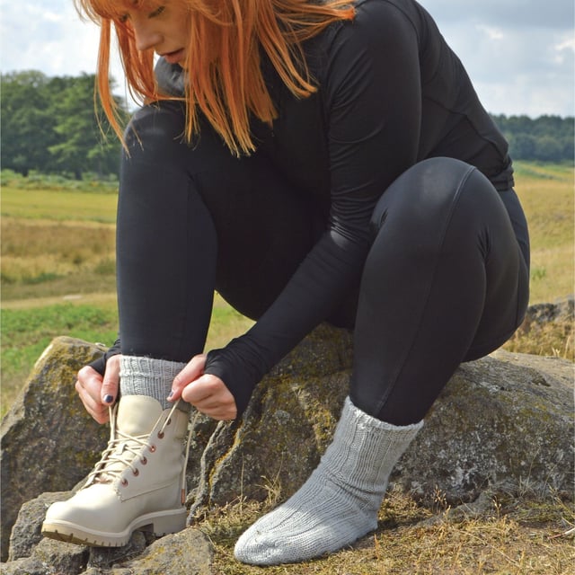 Ladies 100% Wool Bed Socks: Socks that are made from 100% wool and that are fully functional can be hard to find. These ladies 100% wool bed socks are as warm and cuddly as they look. Wool is traditionally known to be one of the best insulating fibres around, trapping warm air and holding it close to your skin. With a 100% wool material composition, these socks have the ultimate ability to keep your feet warm. The top of the sock also has a loose fit - facilitating blood circulation, great if you are relaxing around the house or in bed for a less constrictive feel. These ladies socks also have a ribbed Nordic-like pattern that rides up the sock from the toe to the welt. This pair of ladies 100% wool bed socks are available in the colour natural and are a size 4-7 UK 37-42 eur. They come in a 1 pair pack and are machine washable. Extra Product Details: - 1 Pair Pack - Size 4-7 UK 37-42 - Ladies socks - 100% Wool - Perfect for relaxing - Non-constricting top - Nordic-like knitting pattern - Machine Washable